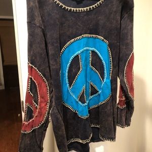 Black appliqué top with turquoise peace sign